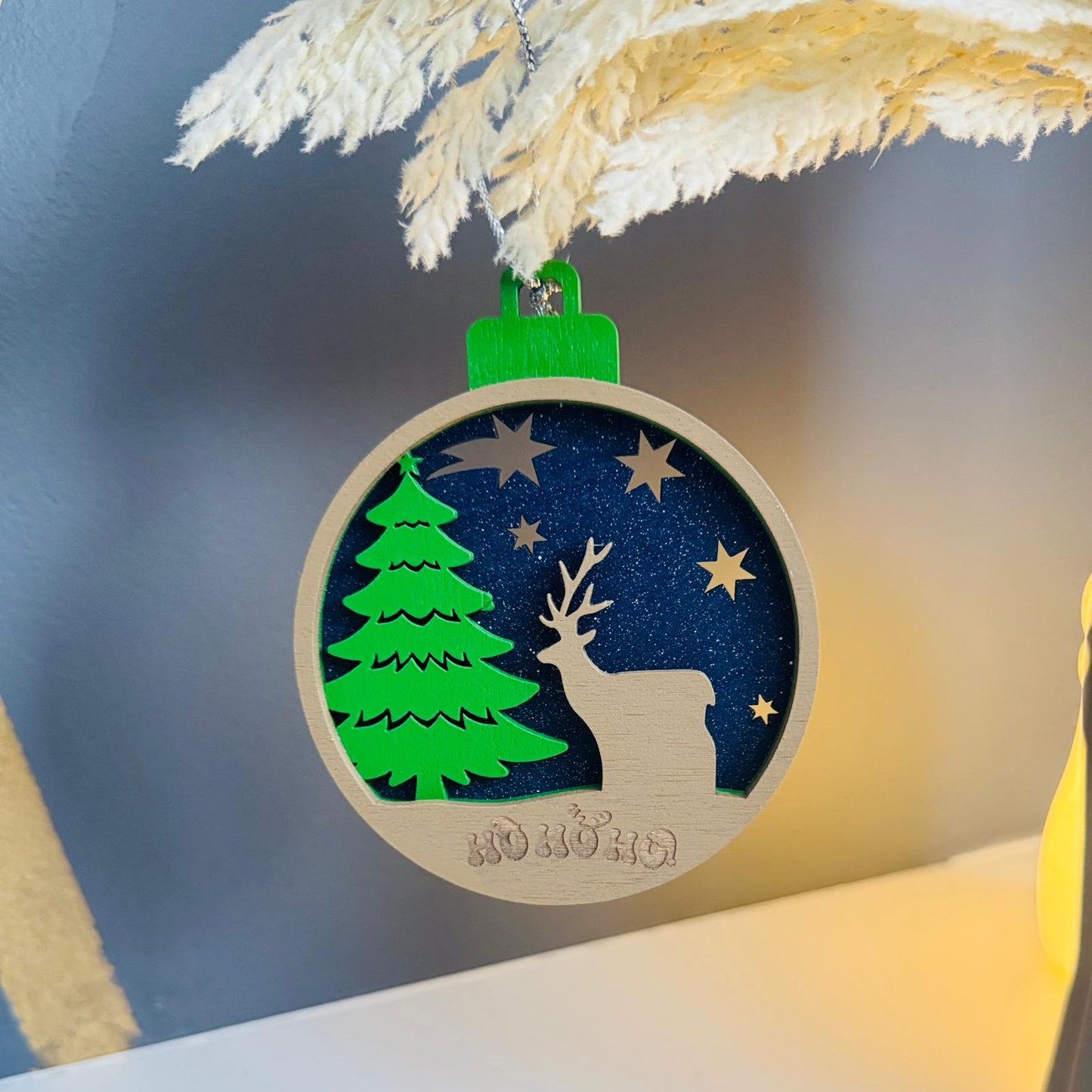 Deer with Christmas tree ornament